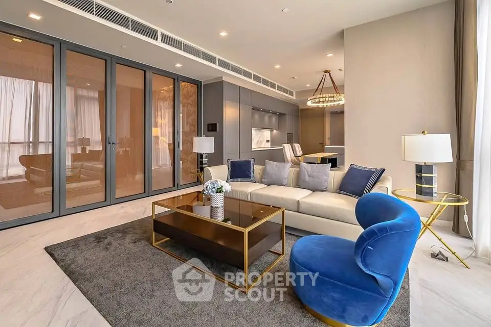Luxurious modern living room with elegant furniture and open kitchen layout, perfect for stylish urban living.