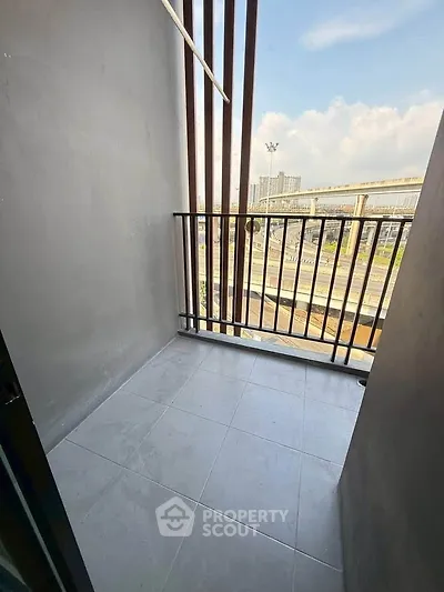 Modern balcony with city view and sleek railing design