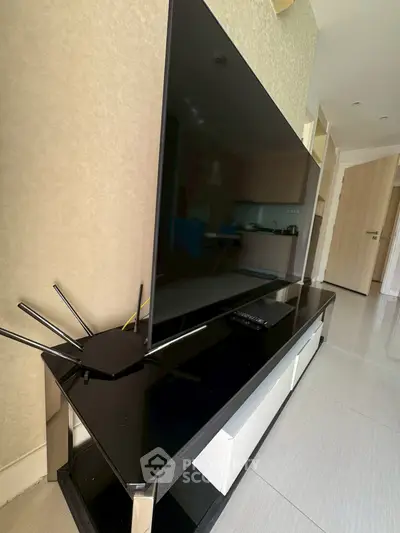 Modern living room with sleek TV setup and minimalist decor