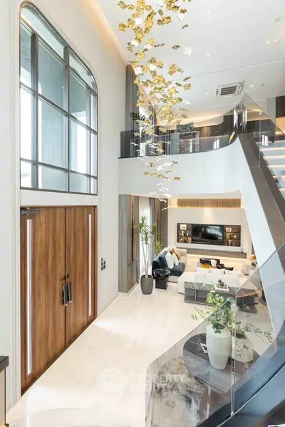 Luxurious modern living room with high ceiling and elegant decor