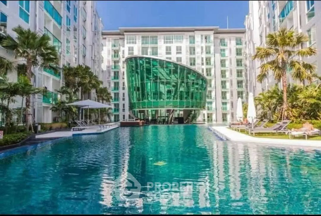 Luxurious modern apartment complex with stunning pool and unique architecture.