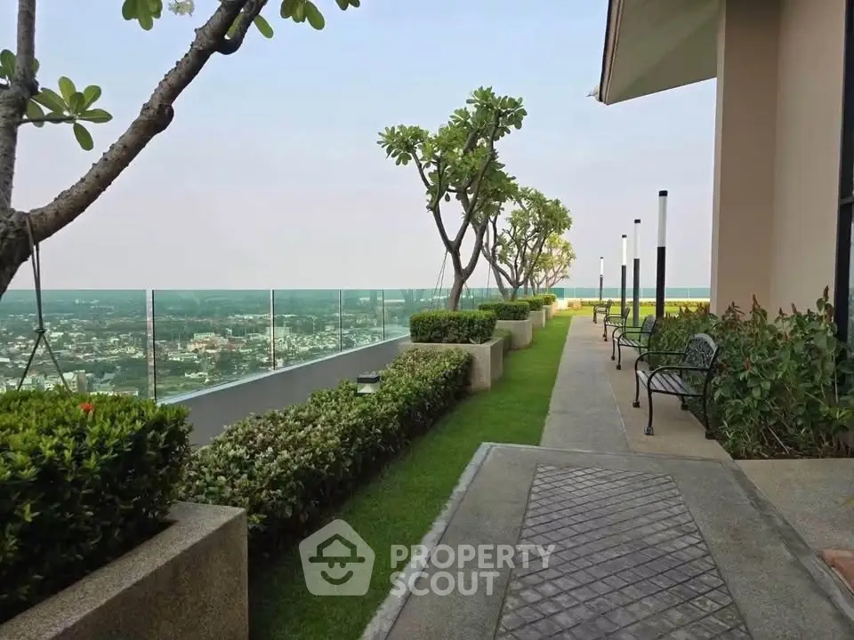 Stunning rooftop garden with panoramic city views and lush greenery.