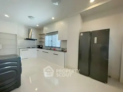 Spacious modern kitchen with sleek appliances and open layout