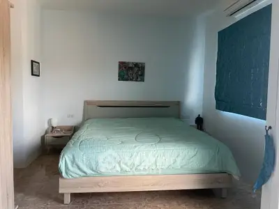 Cozy bedroom with modern decor and natural light