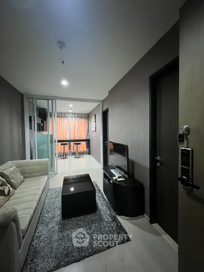 Modern living room with cozy sofa and sleek TV setup in stylish apartment