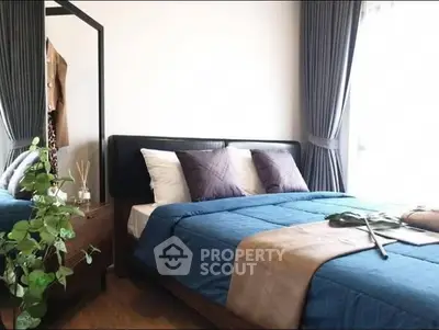 Modern bedroom with stylish decor and natural light