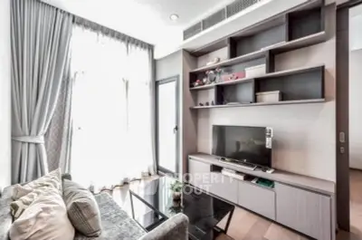 Modern living room with stylish shelving and large window, perfect for relaxation and entertainment.