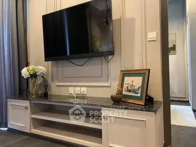 Elegant living room with wall-mounted TV and stylish decor
