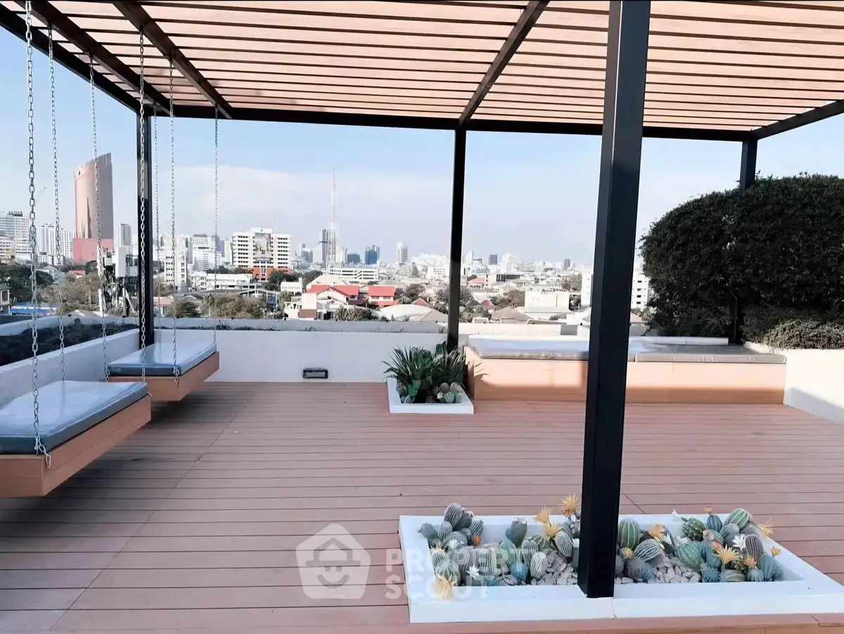 Stunning rooftop terrace with city skyline view and modern pergola design.