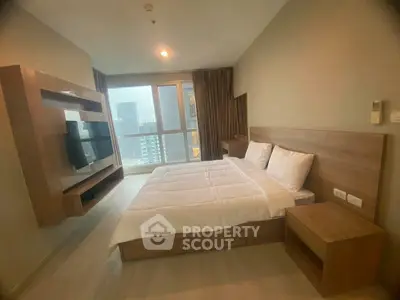 Modern bedroom with large window and city view, featuring sleek wooden furniture and cozy ambiance.