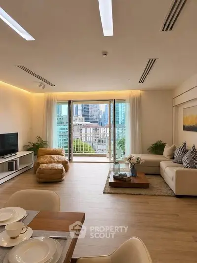 Spacious modern living room with city view and elegant decor