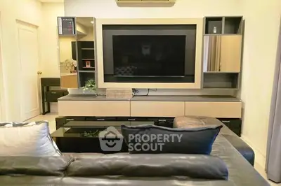 Modern living room with sleek entertainment center and cozy seating