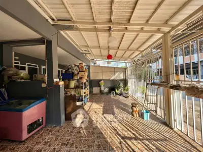 Spacious covered patio with storage potential and natural light