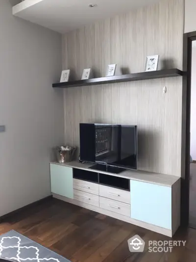 Modern living room with sleek TV stand and decorative shelf