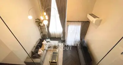 Elegant modern living room with high ceiling and stylish decor