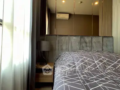 Modern bedroom with stylish decor and natural light
