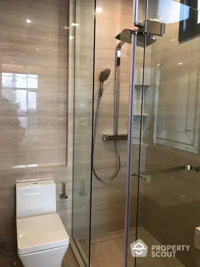 Modern bathroom with glass shower enclosure and sleek design