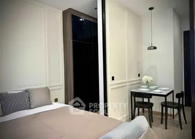 Modern bedroom with cozy dining area in stylish apartment