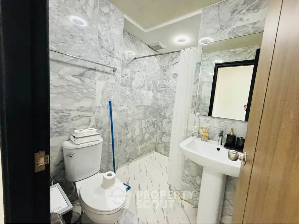 Luxurious marble bathroom with modern fixtures and elegant design