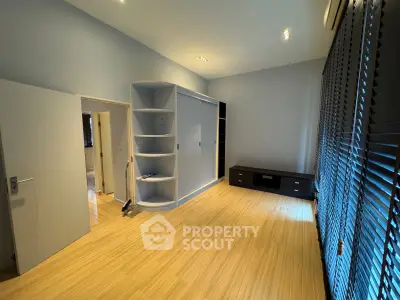 Spacious bedroom with modern design and ample natural light