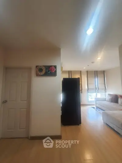 Spacious living room with modern decor and natural light