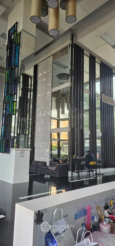 Modern building lobby with high ceilings and stylish decor