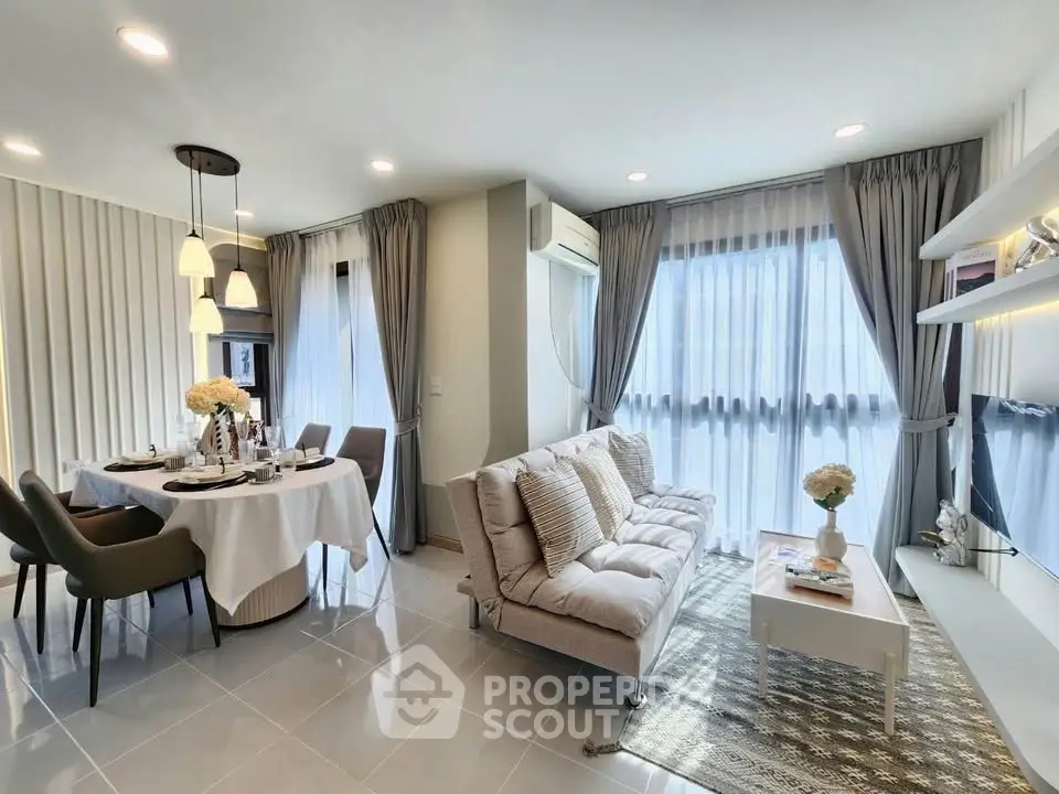Elegant living room with modern decor, large windows, and dining area, perfect for stylish urban living.