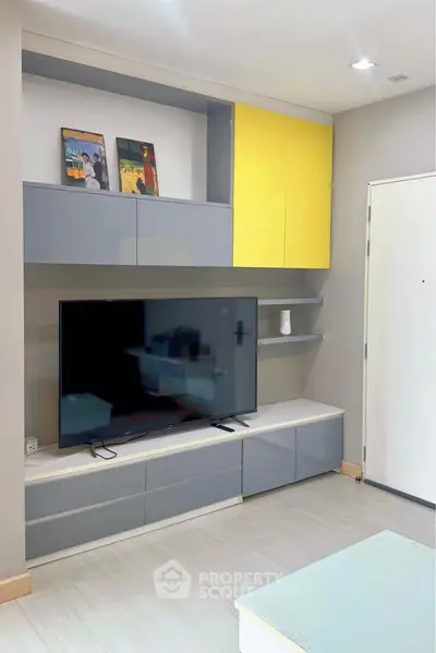 Modern living room with sleek TV unit and stylish shelving, perfect for contemporary living.