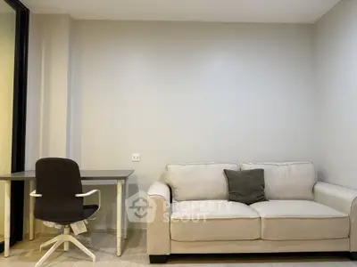 Modern minimalist living room with cozy sofa and sleek desk setup