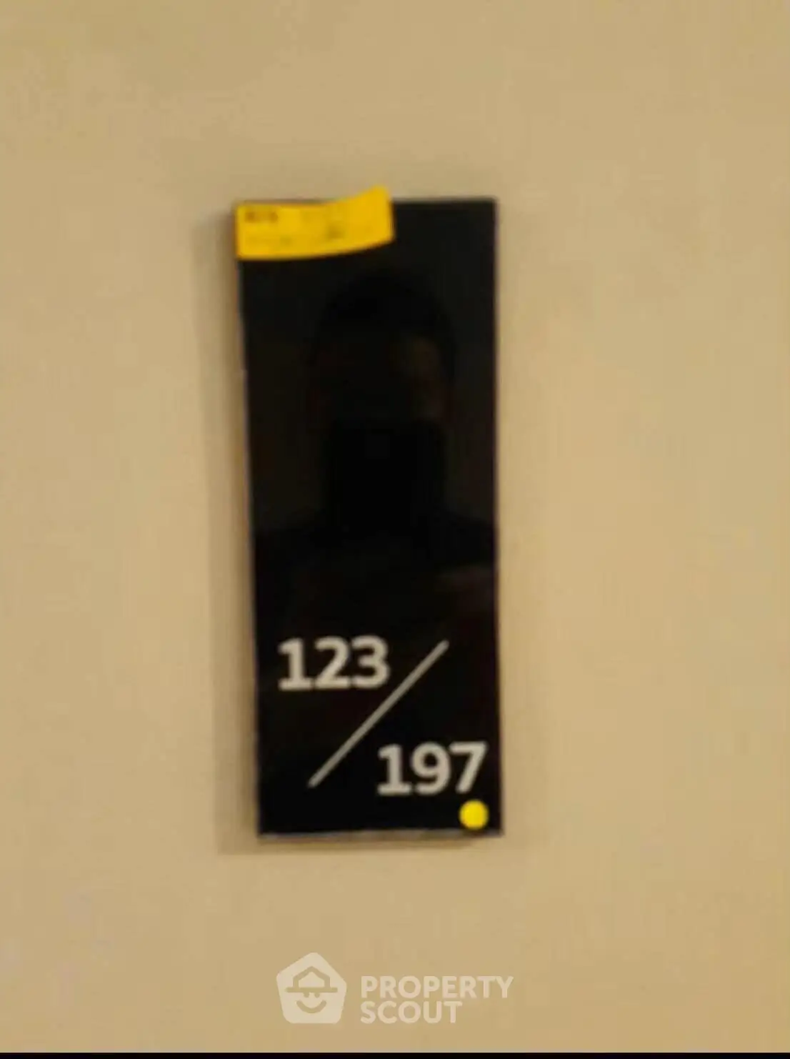 Modern apartment number plaque with sleek design