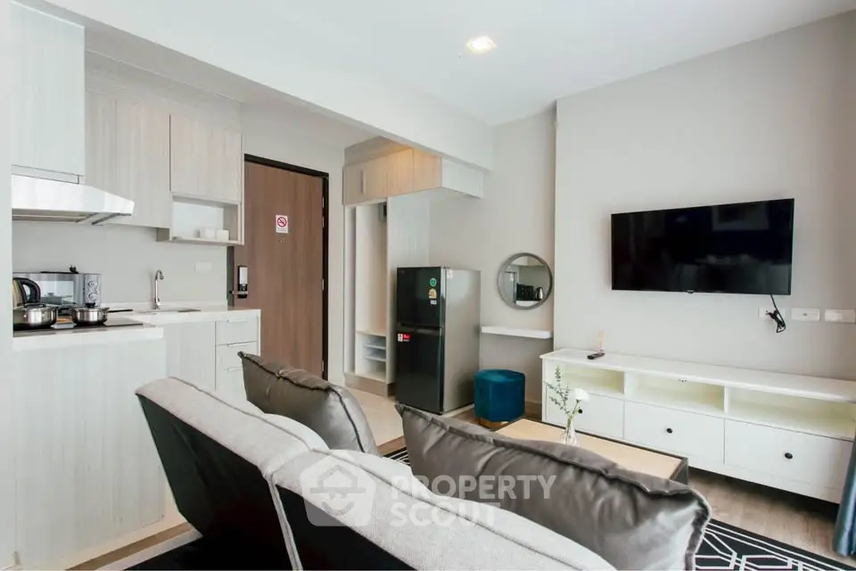 Modern living room with open kitchen and stylish decor