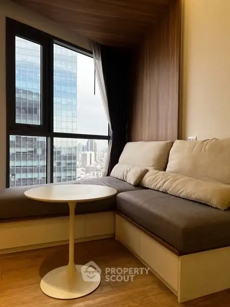 Cozy modern living room with city view and stylish furniture