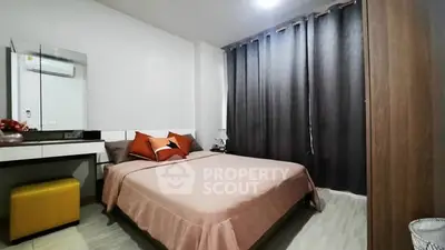 Cozy bedroom with modern decor and ample natural light