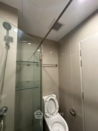 Modern bathroom with glass shower and sleek tile design