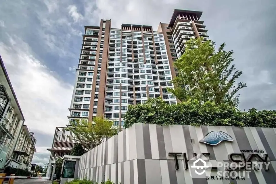 Modern high-rise condominium with lush greenery at The Sky Sriracha.