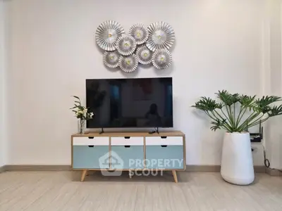 Stylish living room with modern TV stand and decorative wall art