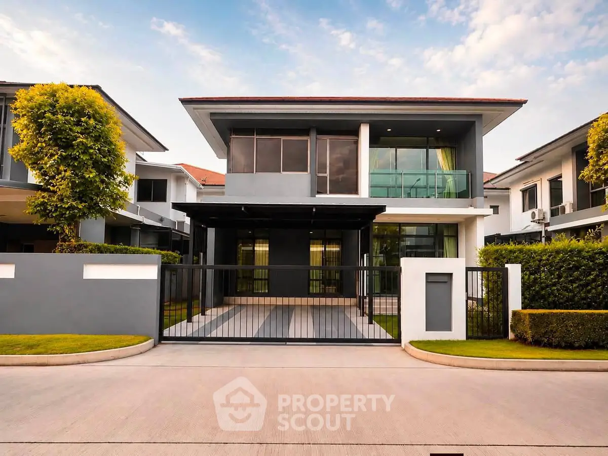 Modern two-story house with sleek design and spacious driveway in a serene neighborhood.