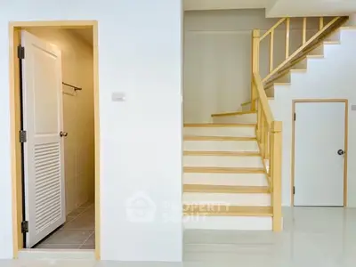 Modern interior with staircase and bathroom door, showcasing minimalist design.