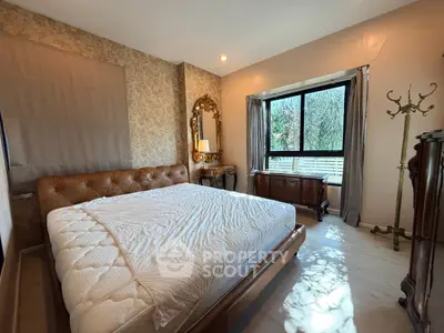 Luxurious bedroom with elegant decor and large window view