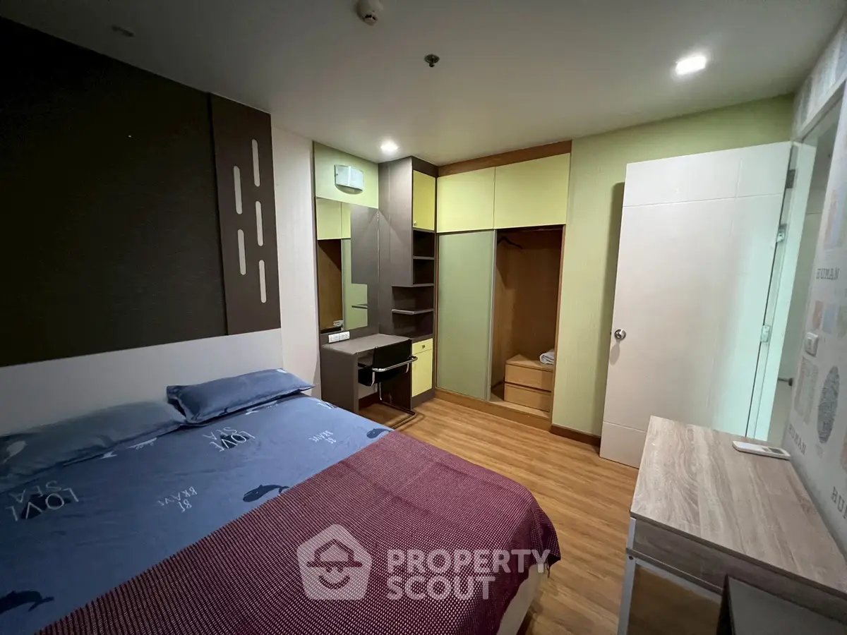 Modern bedroom with stylish decor and ample storage space