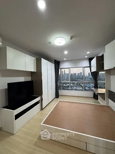 Modern living room with city view and sleek furniture