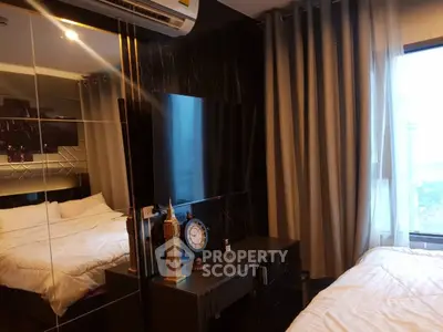 Luxurious bedroom with mirrored wall and modern decor