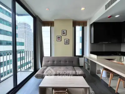 Modern living room with city view and sleek furnishings in high-rise apartment.