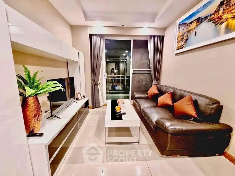 Modern living room with sleek furniture and stylish decor in a cozy apartment setting.