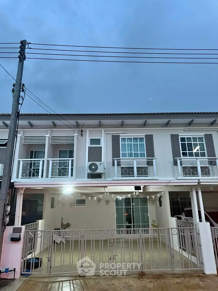 Charming townhouse with modern facade and spacious front patio