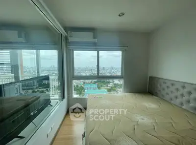 Modern bedroom with panoramic city view and stylish decor