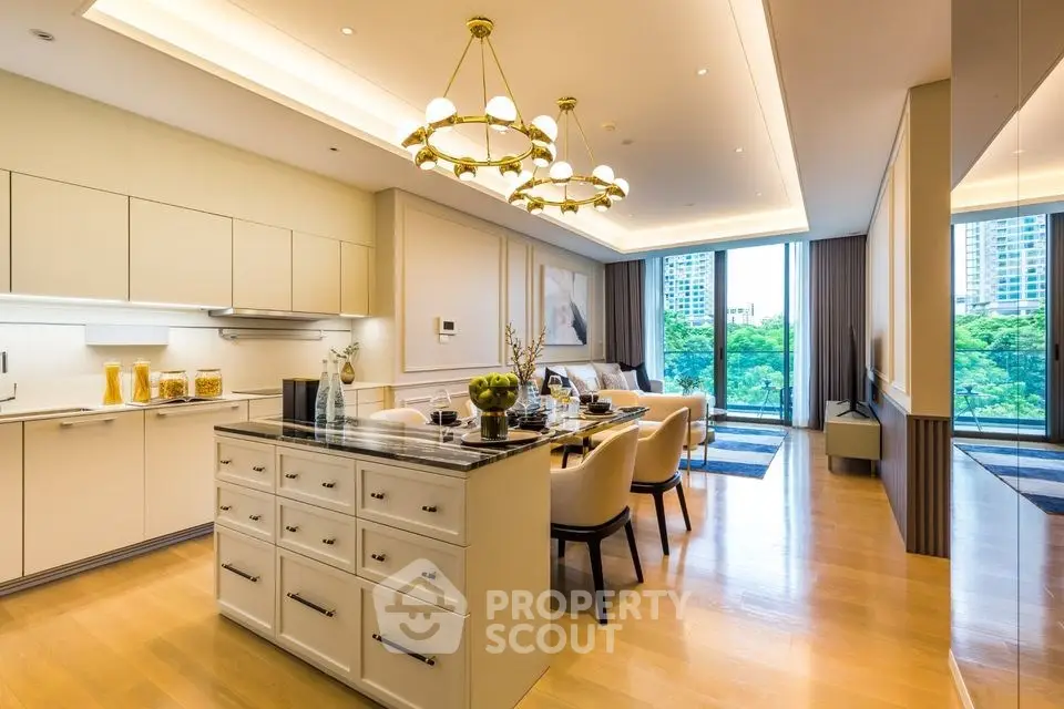 Luxurious open-plan kitchen and dining area with elegant lighting and large windows offering a stunning view.
