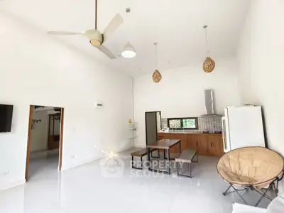 Spacious modern living room with high ceiling and minimalist decor