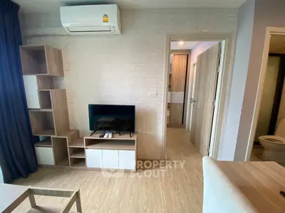 Modern living room with air conditioning and stylish furniture in a cozy apartment.