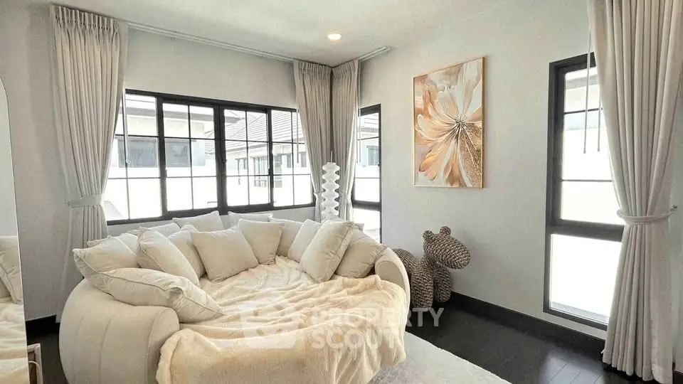 Elegant living room with plush white sofa and modern decor